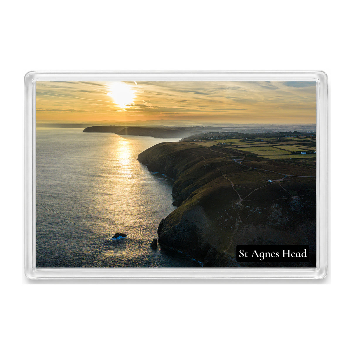 St Agnes Head fridge magnet showing sunrise reflecting along the coast, patterned cloud and the NCI lookout