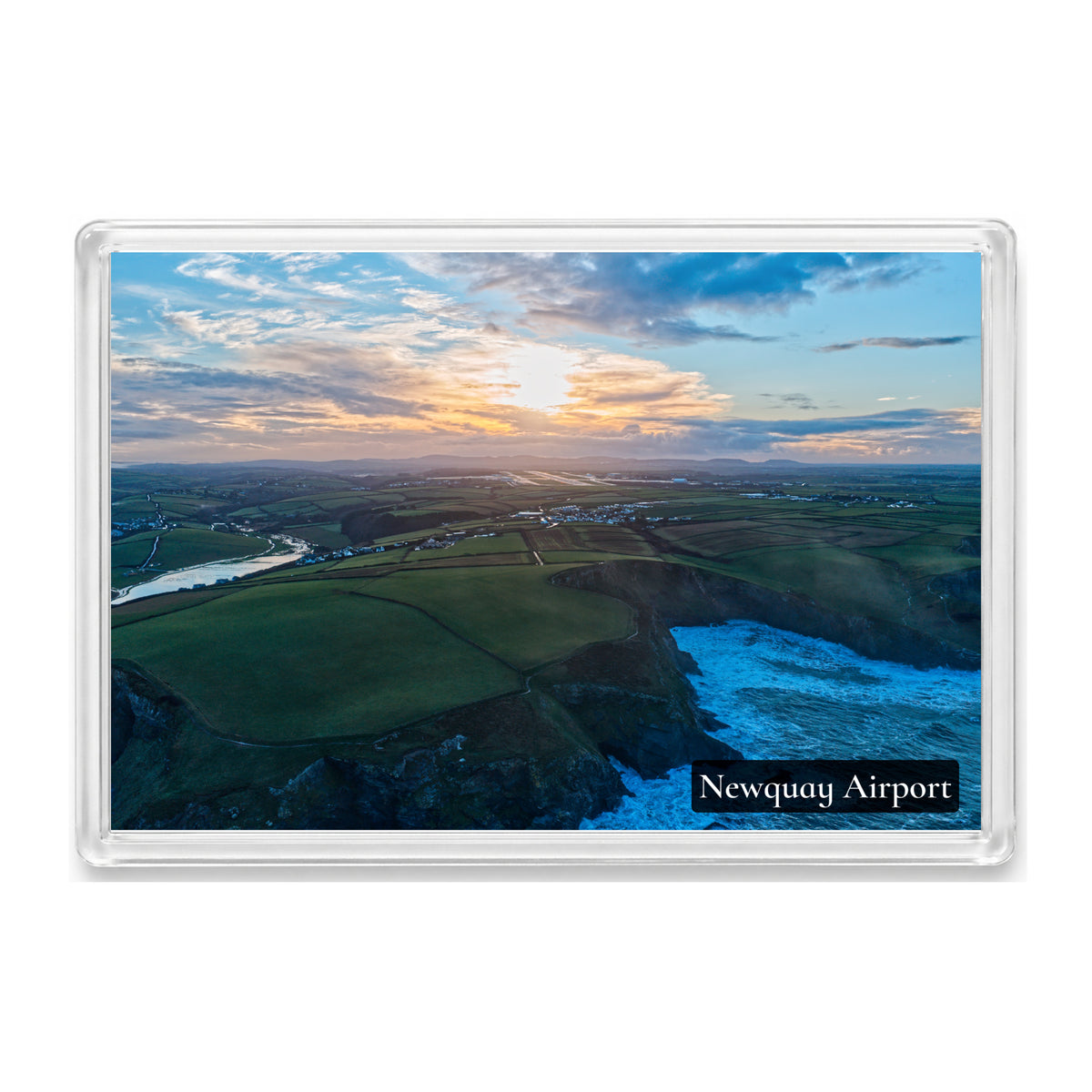 Newquay Airport fridge magnet showing wet runways and waterlogged fields under a subdued winter sunrise
