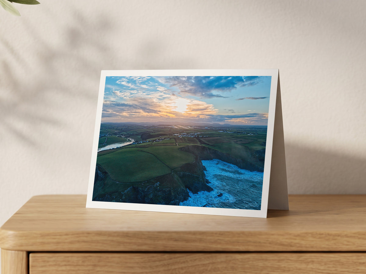 Premium A5 greeting card showing Newquay Airport and waterlogged fields beyond the north Cornwall cliffs at a winter sunrise
