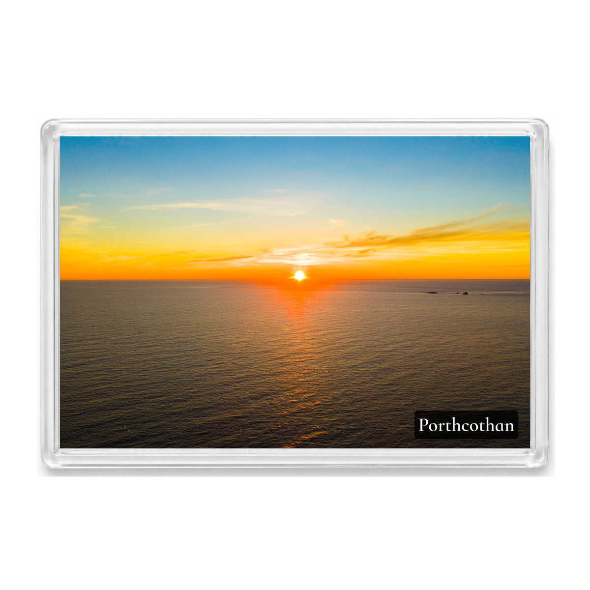 Porthcothan fridge magnet showing an orange and yellow sunset over open sea with The Quies rocks on the horizon