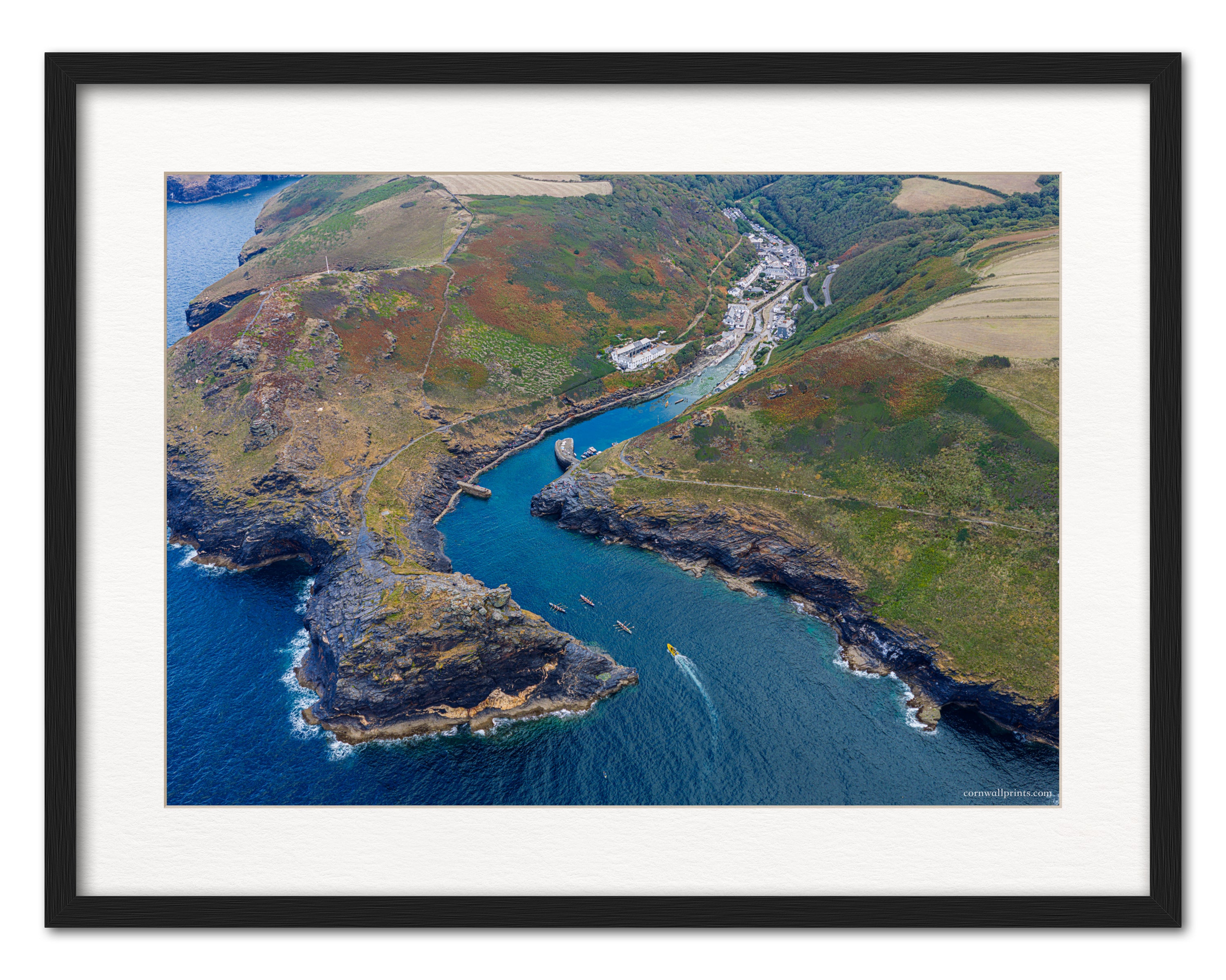 Boscastle harbour aerial photograph displayed in a black frame with white mount