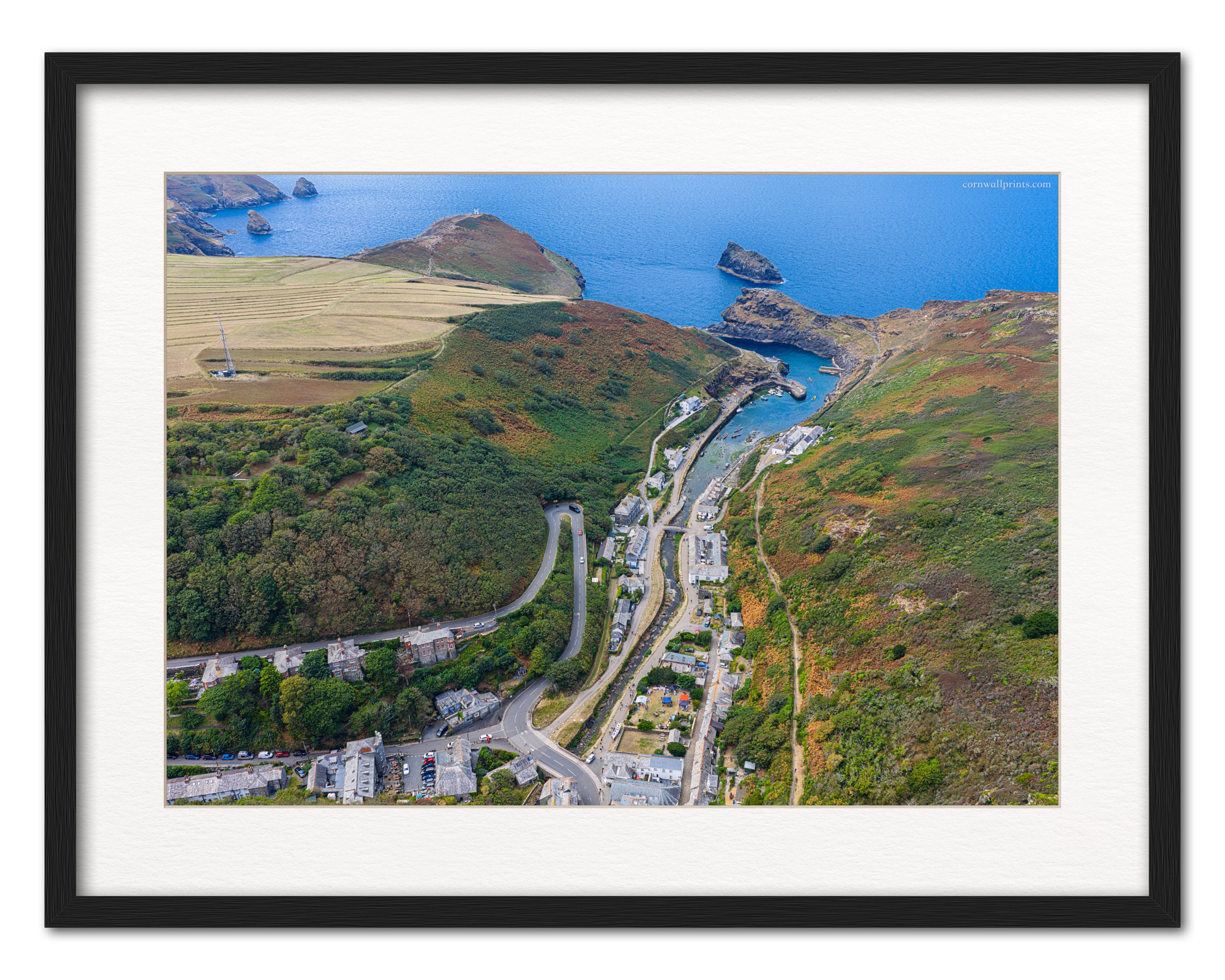 Boscastle harbour valley and Forrabury Stitches aerial photograph displayed in a black frame