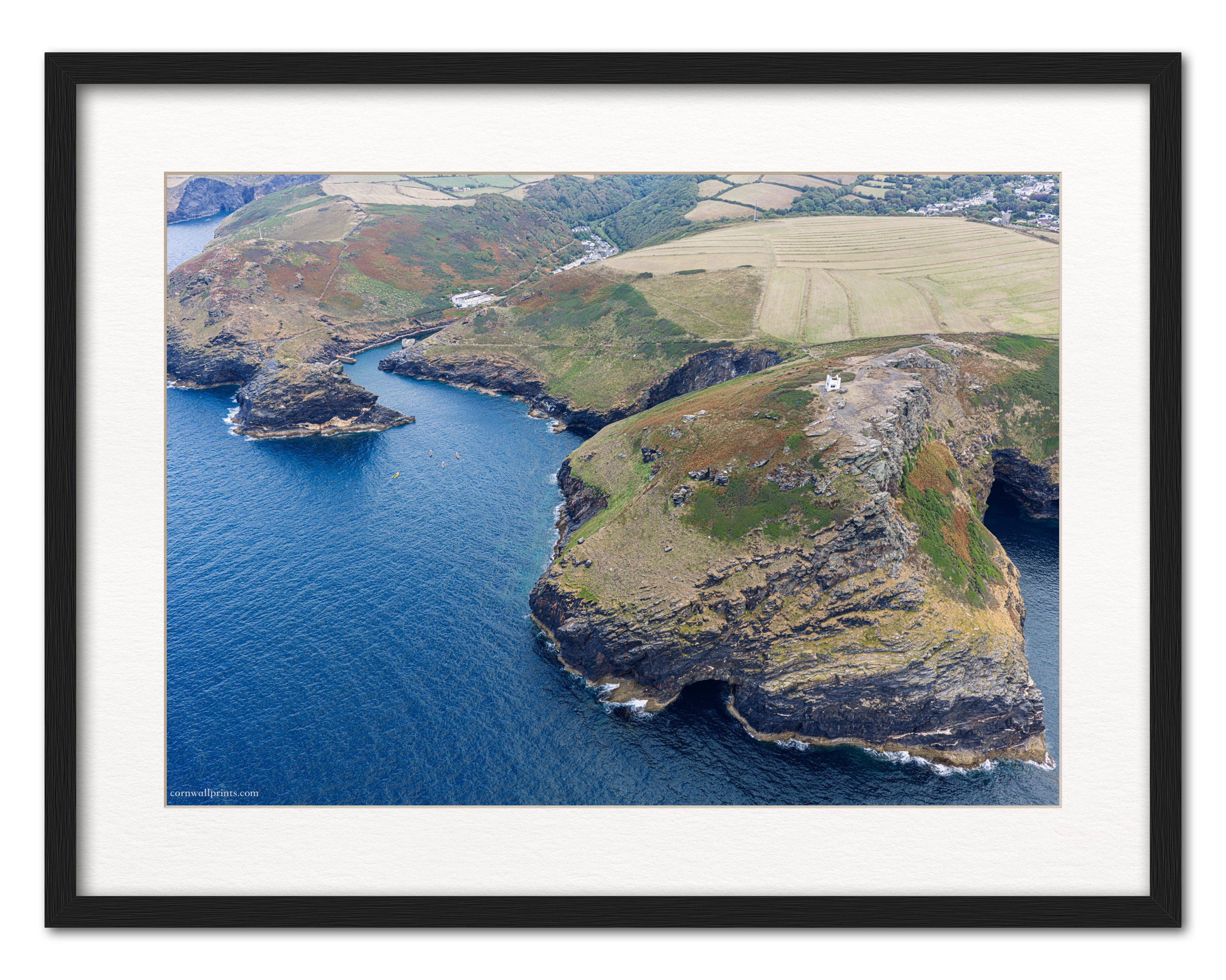 Boscastle Willapark lookout and harbour entrance aerial photograph displayed in a black frame with white mount