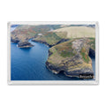 Boscastle fridge magnet showing the white NCI lookout on Willapark above deep blue water and the narrow harbour entrance