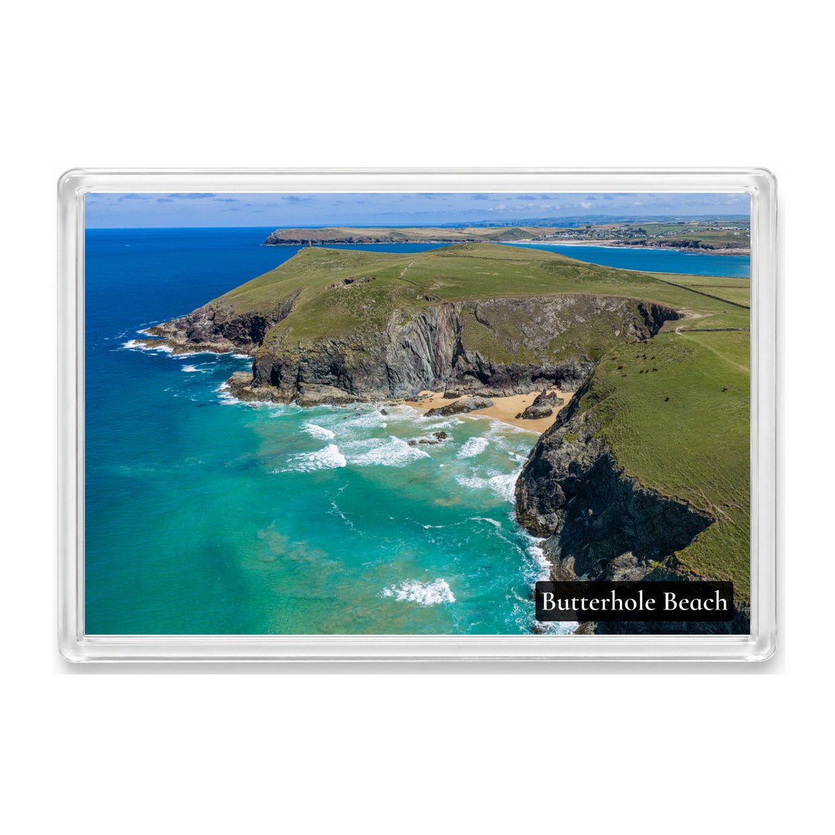 Butterhole Beach fridge magnet showing the cliff-backed cove at low tide with Stepper Point Daymark and Polzeath beyond