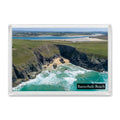 Butterhole Beach fridge magnet showing the cliff-lined cove at low tide with blue water and Daymer Bay beyond