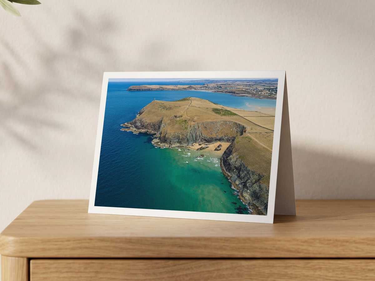 Premium A5 greeting card showing Butterhole Beach below the Stepper Point daymark, with turquoise shallows and Polzeath across the water