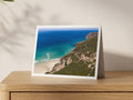 Premium A5 greeting card showing the Wheal Coates engine house on the clifftop above deep blue sea and a sandy beach