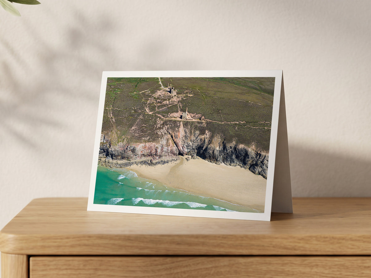Premium A5 greeting card showing the Wheal Coates engine houses above steep cliffs, with sand and surf below