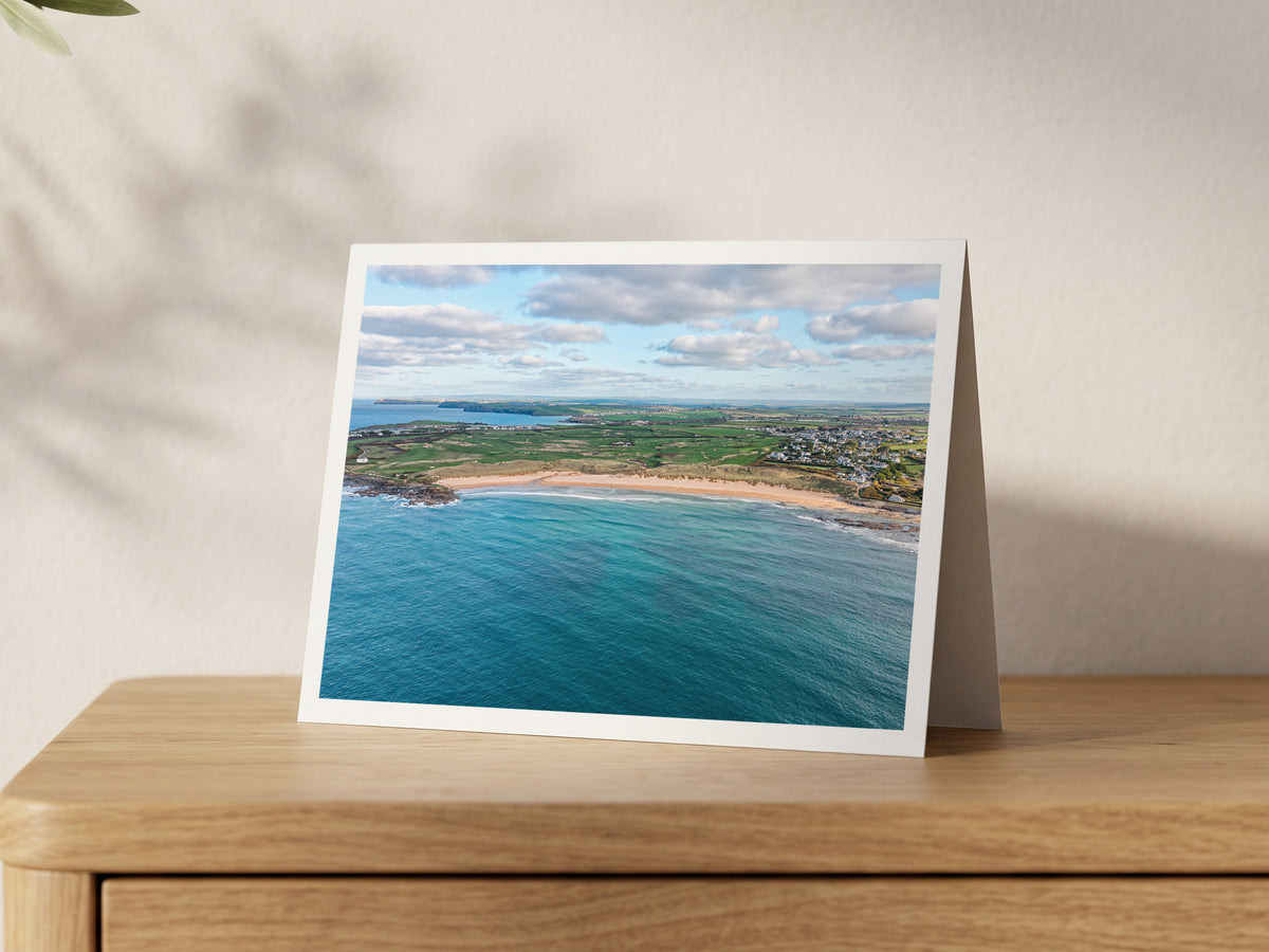 Premium A5 greeting card showing Constantine Bay from the sea, with headlands lined up along the horizon under cloud