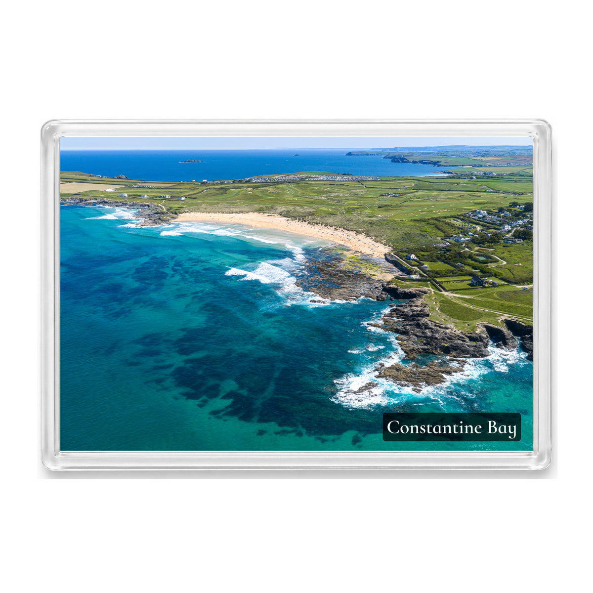 Constantine Bay fridge magnet showing turquoise water around the reef and a beach packed with people on a hot day