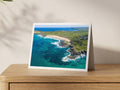 Premium A5 greeting card showing turquoise water around the reef and a busy summer beach at Constantine Bay