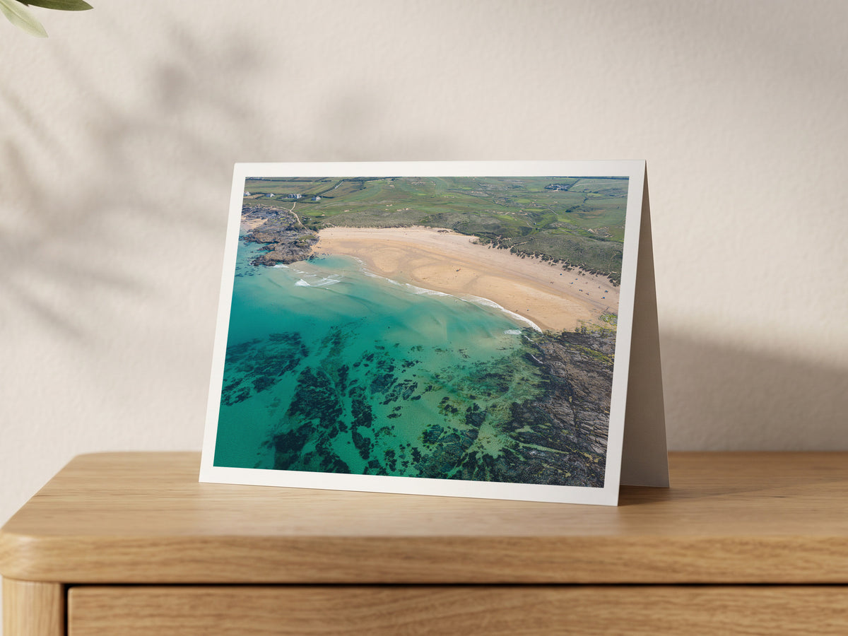Premium A5 greeting card showing Constantine Reef beneath clear turquoise water at high tide beside a pale sandy beach