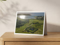 Premium A5 greeting card showing St Enodoc Church in its churchyard with sunlight on the Camel Estuary