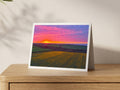 Premium A5 greeting card showing a daffodil field near Porthcothan under a pink and orange sunset