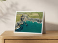 Premium A5 greeting card showing Fox Cove’s narrow beach and cliffs above clear summer water