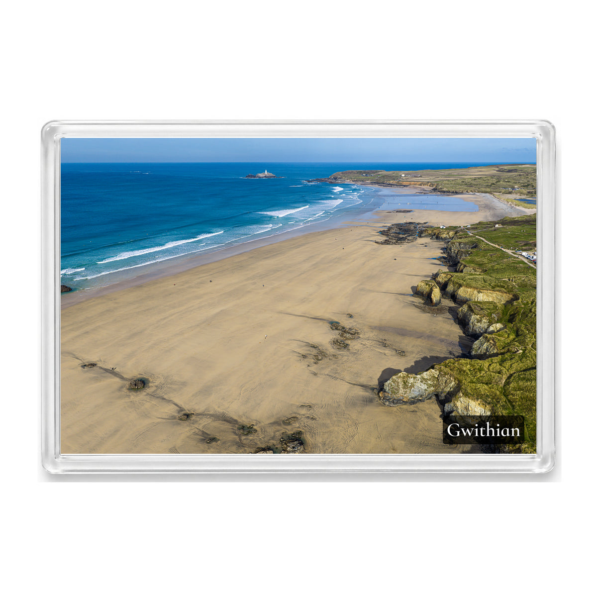 Expansive Gwithian beach with golden sand, textured cliffs, clean offshore surf and surfers, looking north towards Godrevy Lighthouse, shown in a clear acrylic fridge magnet with a Gwithian label