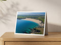 Premium A5 greeting card showing turquoise shallows and dark rocks at Harlyn Bay looking south-east along the beach