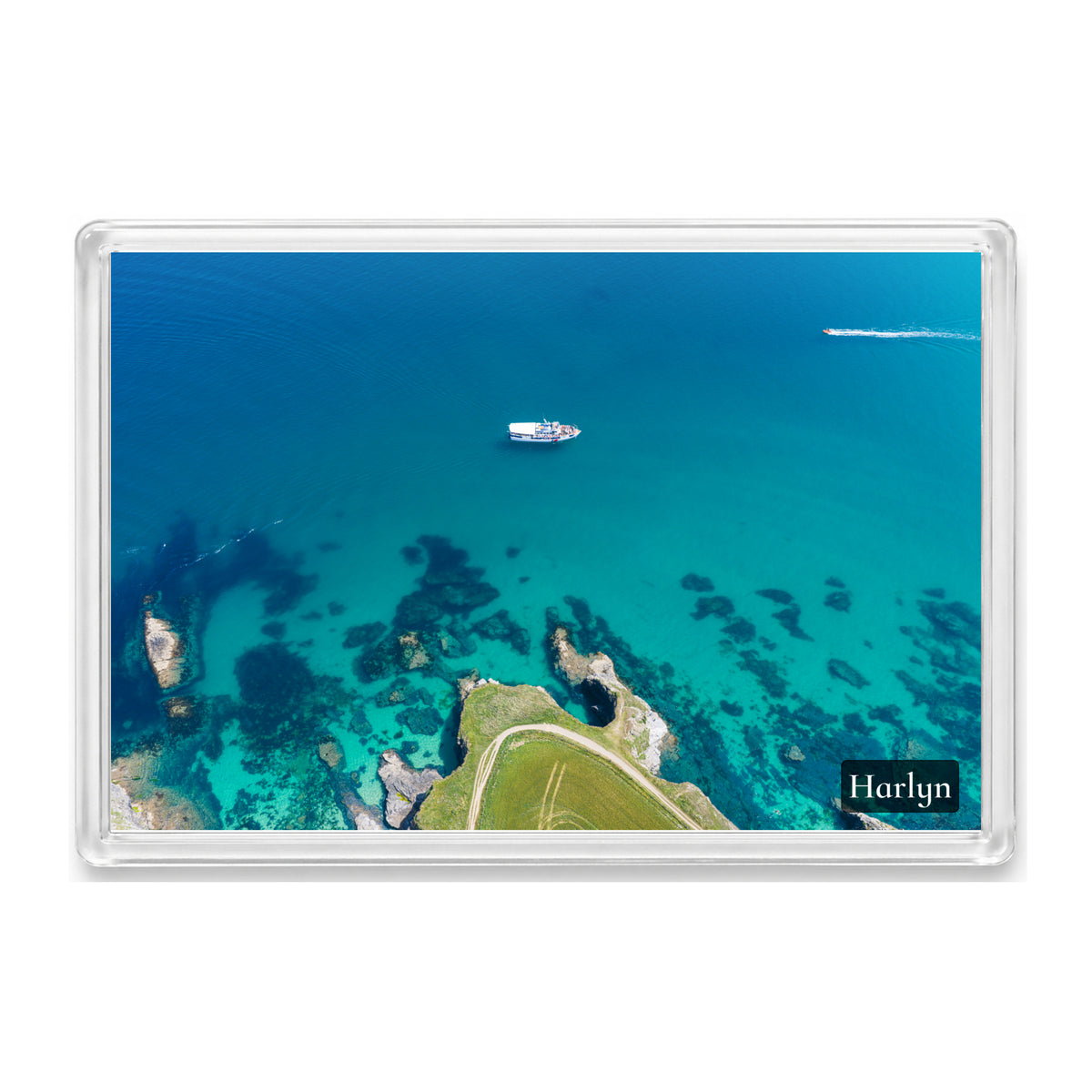 Harlyn fridge magnet showing a small ferry crossing flat, clear, richly coloured water just offshore from Harlyn Bay