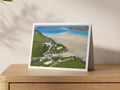 Premium A5 greeting card showing Hawker’s Cove at low tide with estuary sandbars and Polzeath beyond