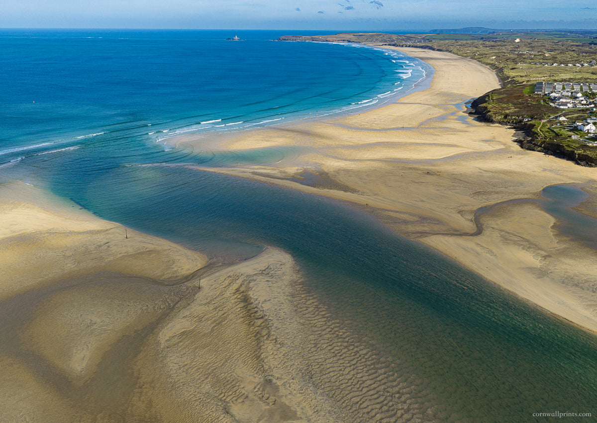 Hayle Estuary sandbanks and clean autumn surf towards Gwithian and Godrevy Lighthouse in bright sunshine, photographed from above