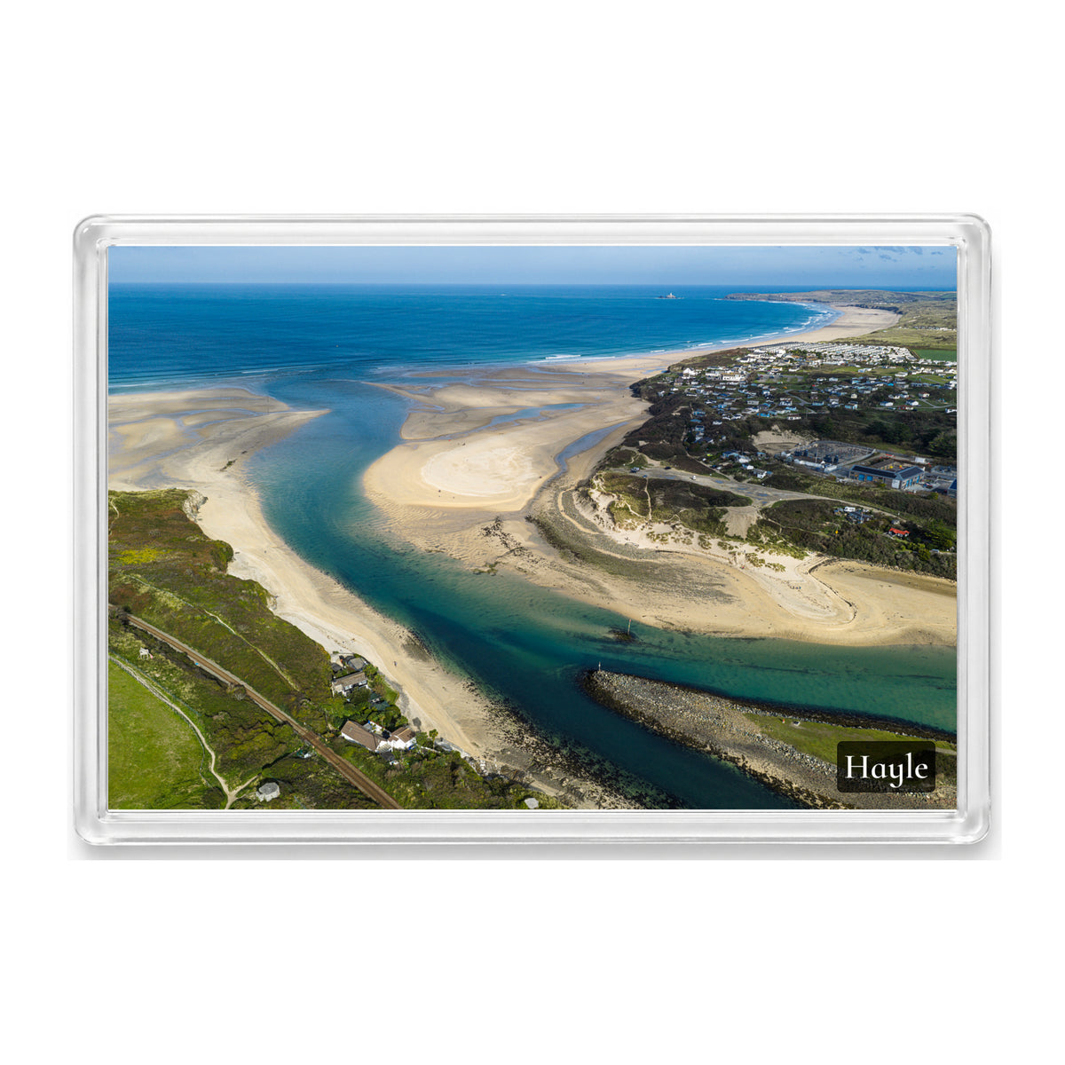 Turquoise Hayle Estuary channels and textured pale sandbanks, viewed from the Porthkidney side towards Gwithian and distant Godrevy Lighthouse, shown in a clear acrylic fridge magnet with a Hayle label