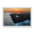 Trevose Head fridge magnet showing the lighthouse centred on the headland against an orange and yellow sunrise