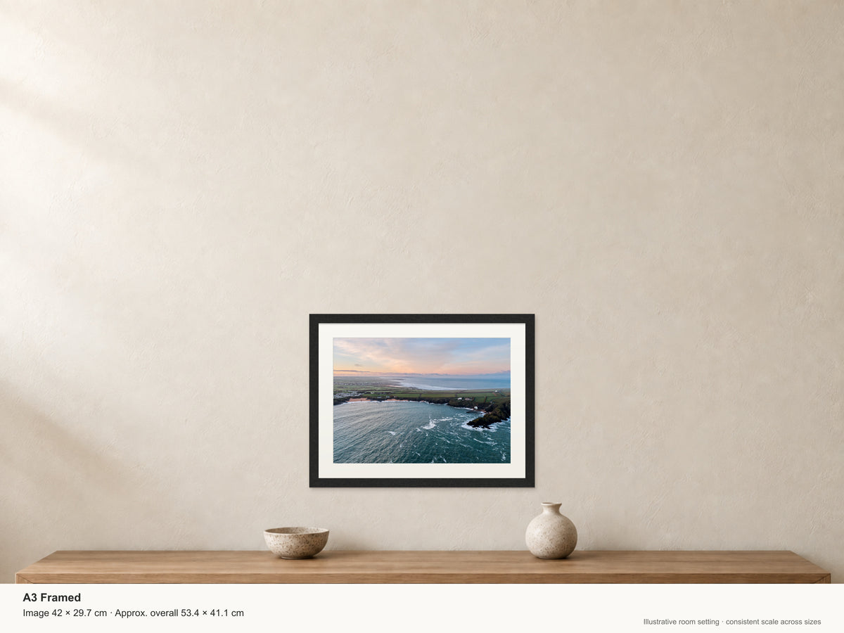Sunrise at Mother Ivey’s Bay Toward Constantine & Newquay — A3 framed, 22mm black stained frame and 35mm mount. Illustrative room view and dimensions.