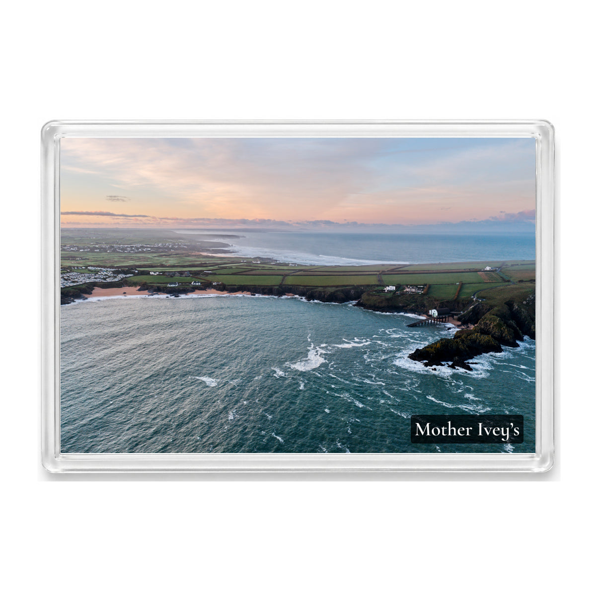 Mother Ivey’s Bay fridge magnet showing the Padstow lifeboat station at sunrise with Constantine Bay and the coast towards Newquay