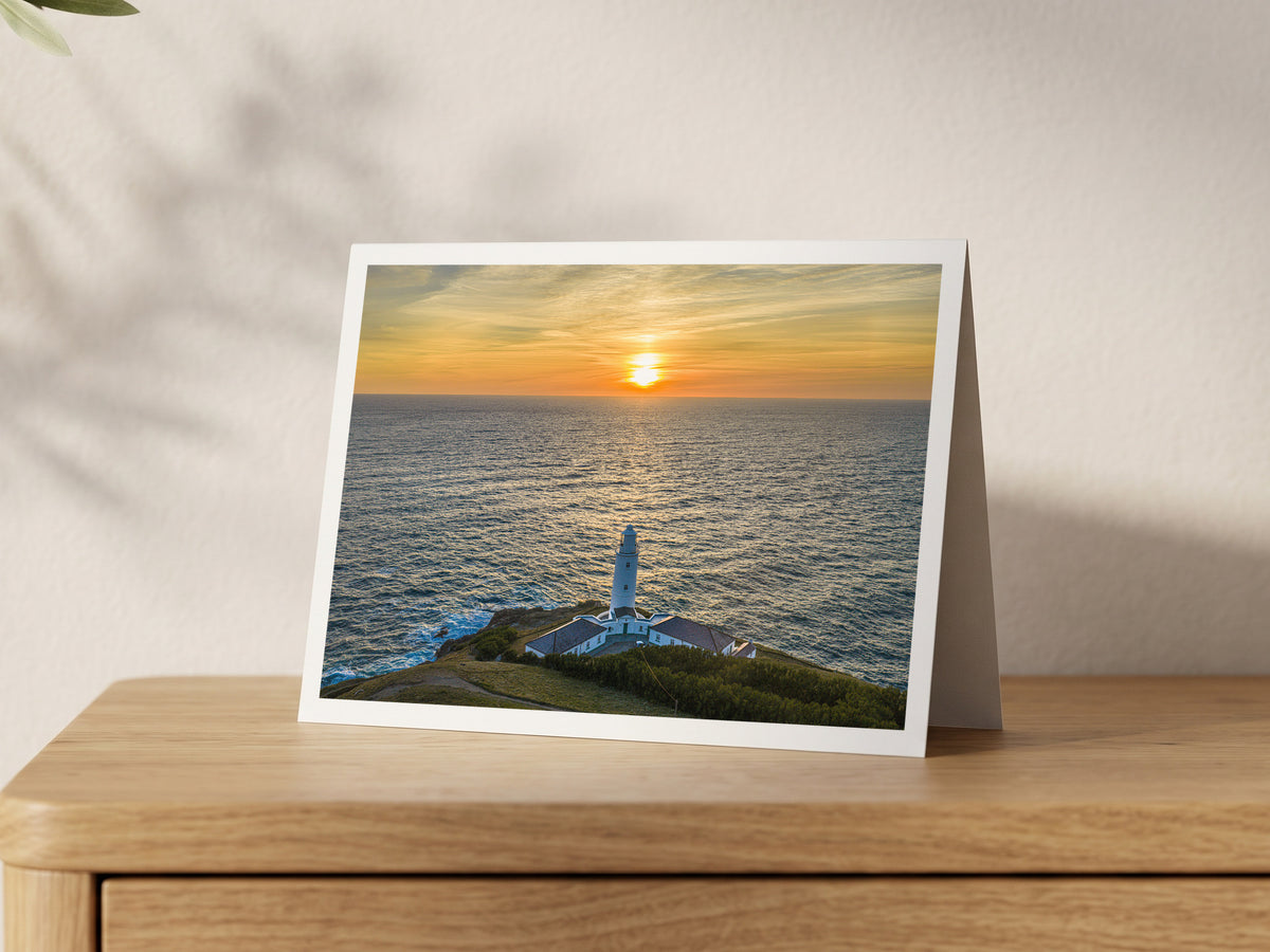 Premium A5 greeting card showing Trevose Head Lighthouse with the sun setting over the Atlantic