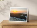 Premium A5 greeting card showing Trevose Head Lighthouse on its headland in hazy low sunlight