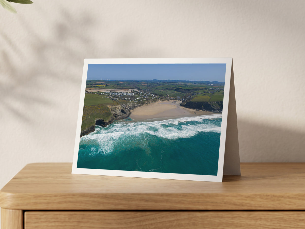 Premium A5 greeting card showing Mawgan Porth beach and village at low tide with surf rolling in