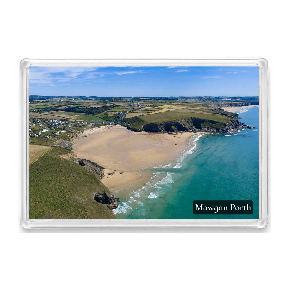 Mawgan Porth fridge magnet showing the low-tide beach and blue sea from the north side, with Watergate Bay beyond