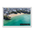 Great Western Beach fridge magnet showing green-blue shallows, swimmers and surfers, with Newquay rising behind the cliffs