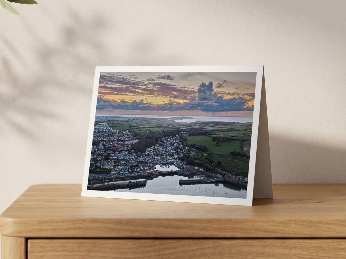 Premium A5 greeting card showing Padstow town and harbour under a dramatic sunset sky