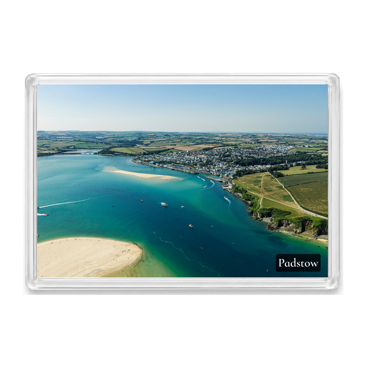 Padstow fridge magnet showing the town in sunshine across the Camel Estuary with a rounded sandbank and boats on blue-green water