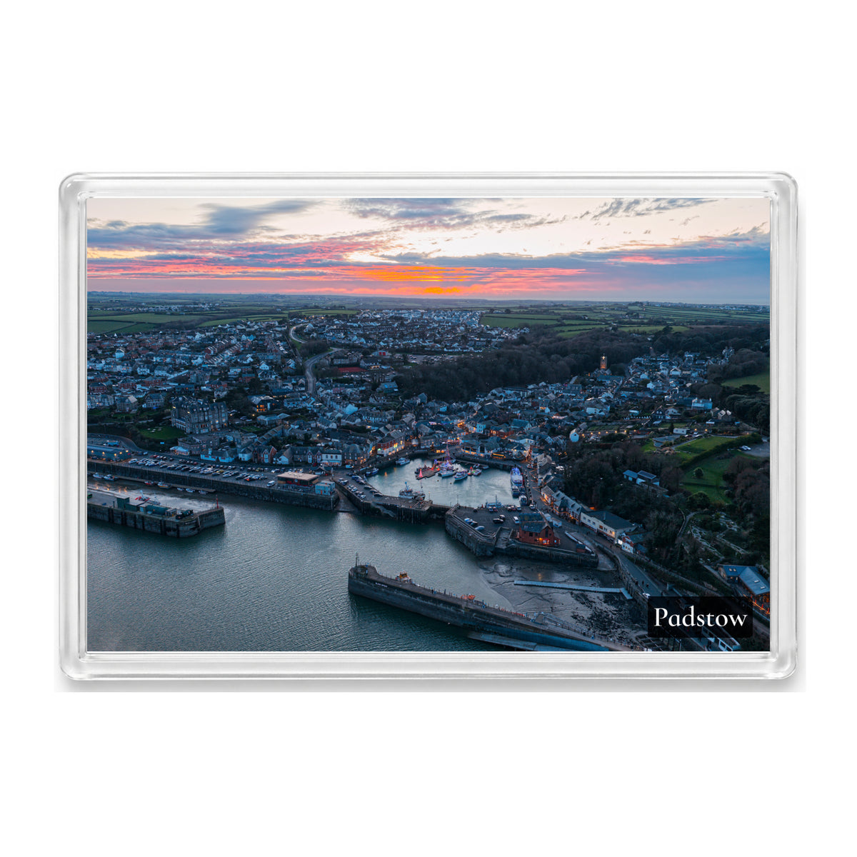 Padstow fridge magnet showing the harbour at dusk with Christmas lights reflected on the water and the church’s illuminated cross
