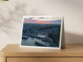 Premium A5 greeting card showing Padstow Harbour with Christmas lights under a sunset sky