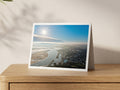 Premium A5 greeting card showing bright winter sun over Padstow harbour and the Camel Estuary