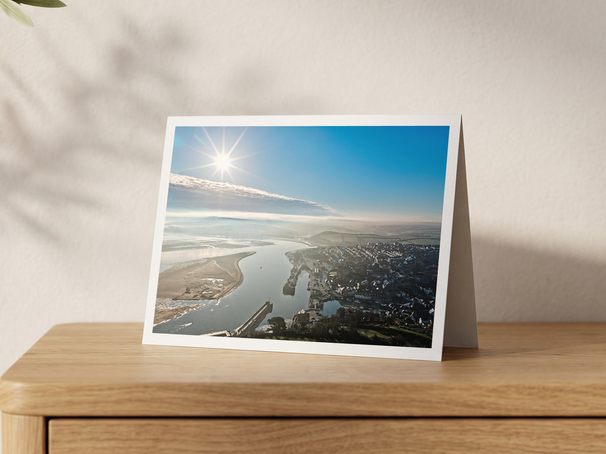 Premium A5 greeting card showing bright winter sun over Padstow harbour and the Camel Estuary