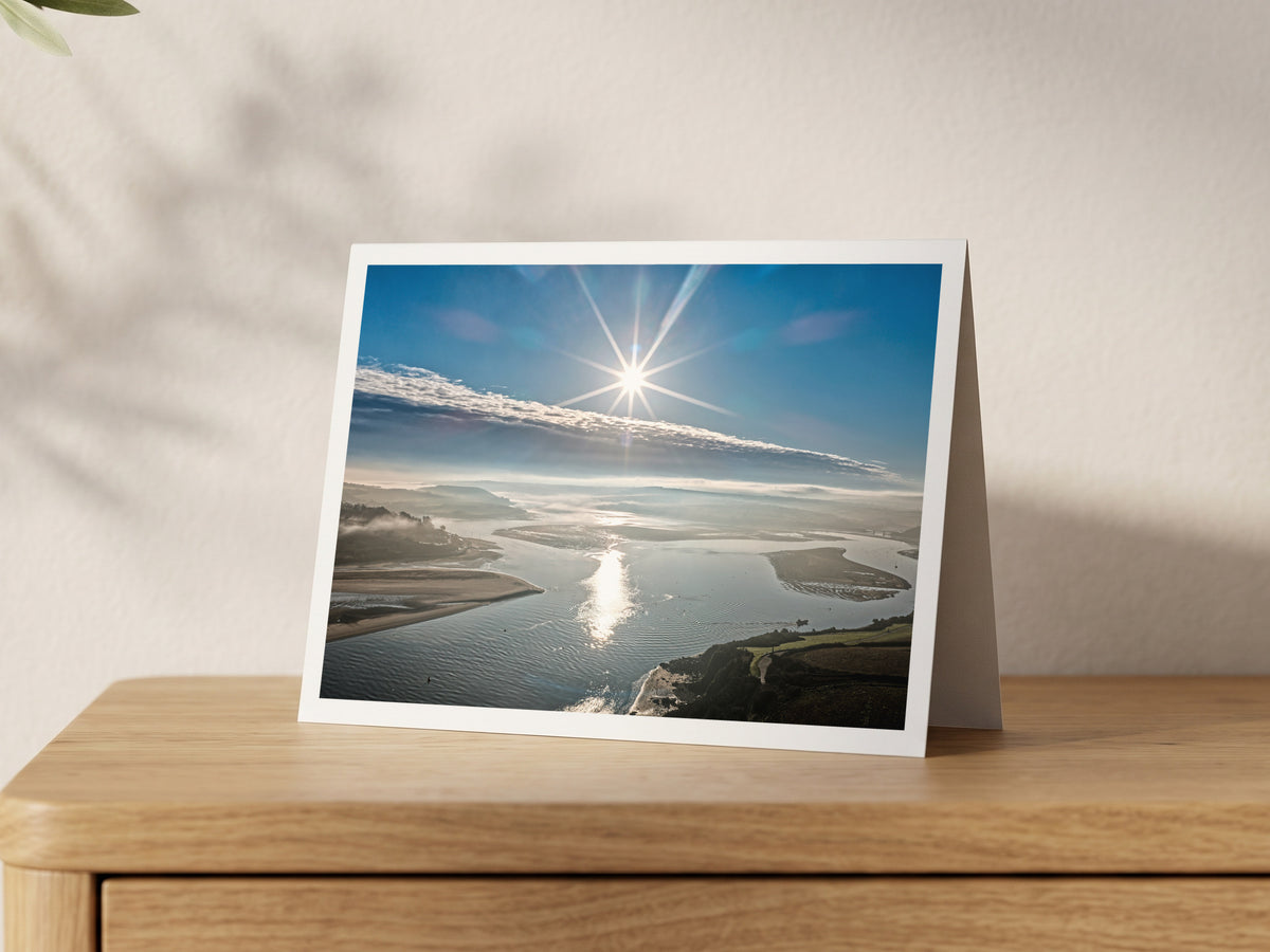Premium A5 greeting card showing winter sun reflecting on the Camel Estuary between sandbanks
