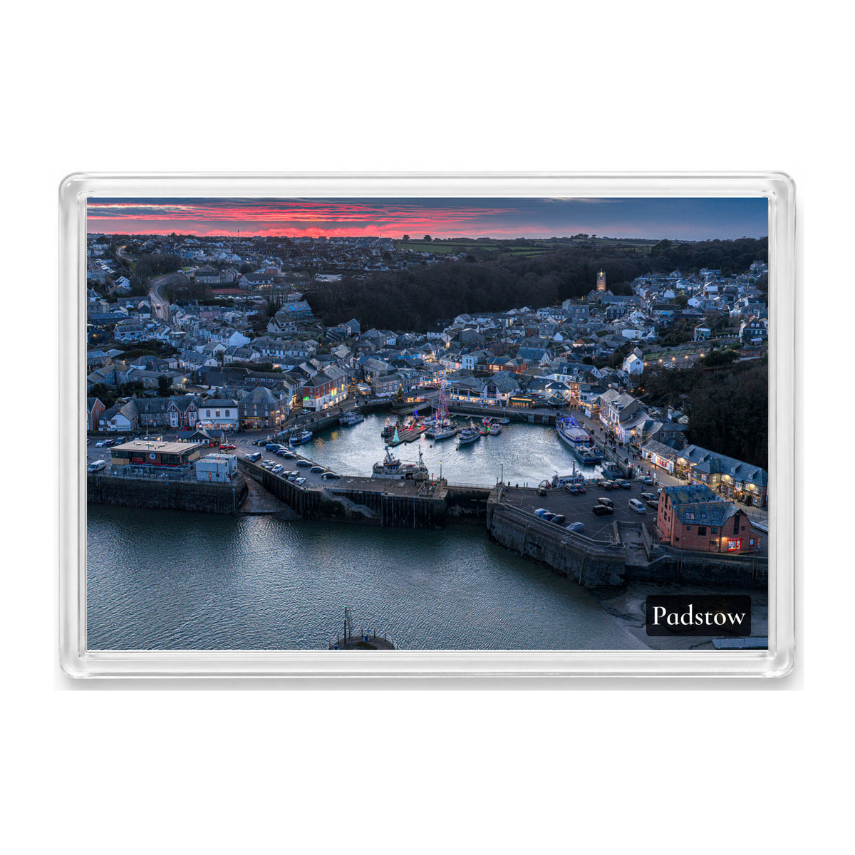 Padstow fridge magnet showing Padstow Harbour at Christmas dusk, with festive lights along the waterfront as the sunset fades
