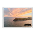 Pentire Point fridge magnet showing a swirling red, yellow and orange sunrise sky above the headland