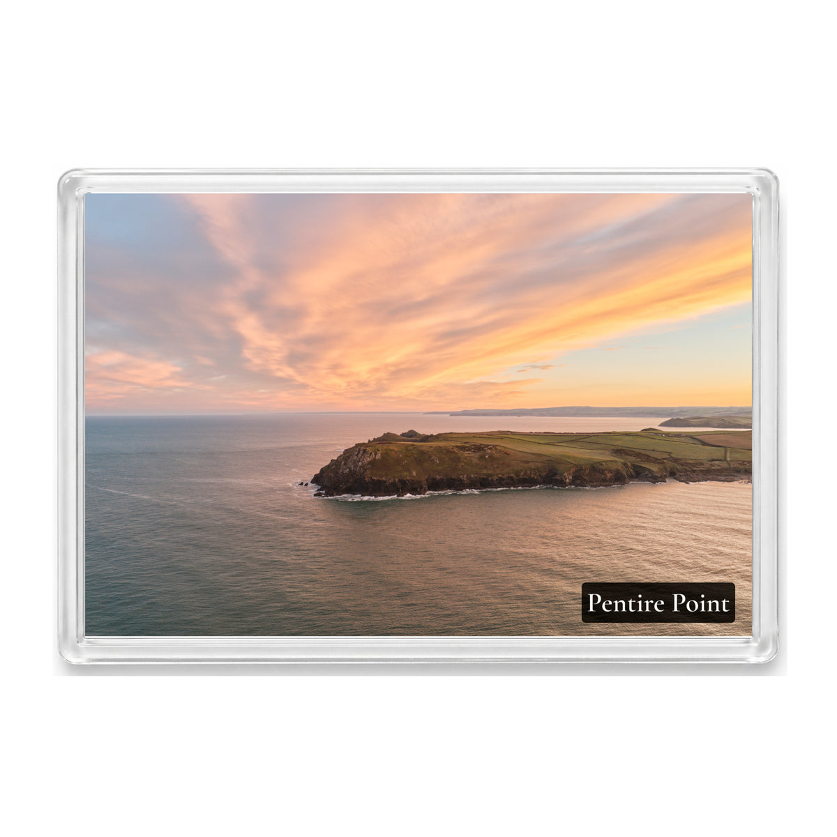 Pentire Point fridge magnet showing a swirling red, yellow and orange sunrise sky above the headland
