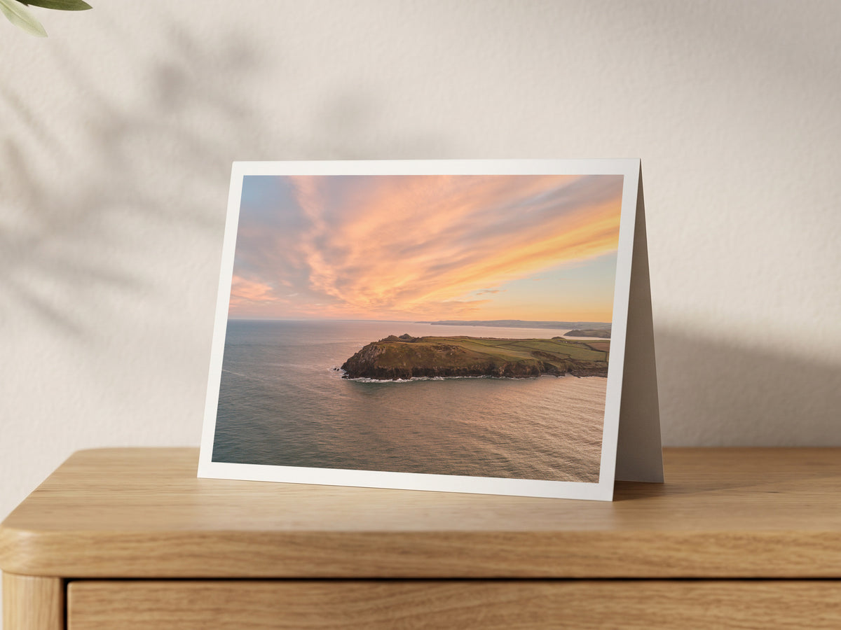 Premium A5 greeting card showing Pentire Point headland beneath a swirling sunrise sky