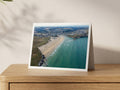 Premium A5 greeting card showing Perranporth beach and town with surfers in the morning swell