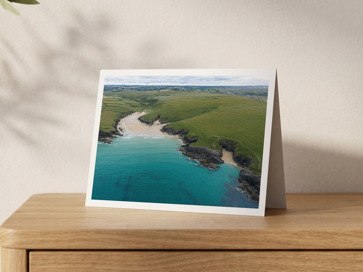 Premium A5 greeting card showing Polly Joke beach between grassy headlands with turquoise water