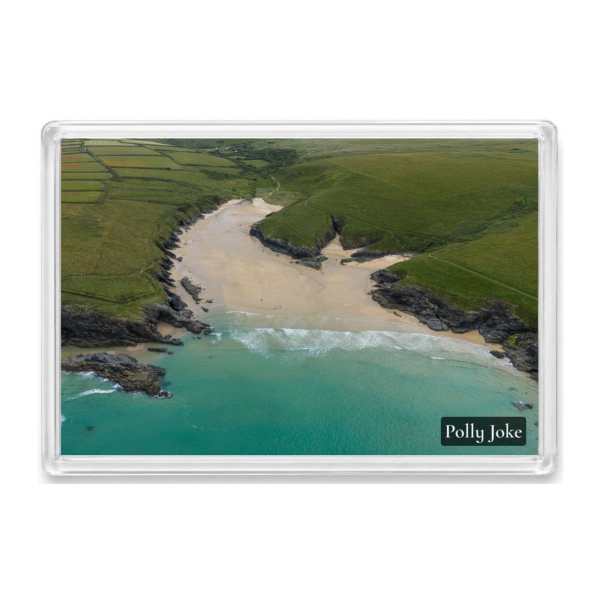 Polly Joke fridge magnet showing the curved cove, pale sand and clear blue-green water, with no sky in view