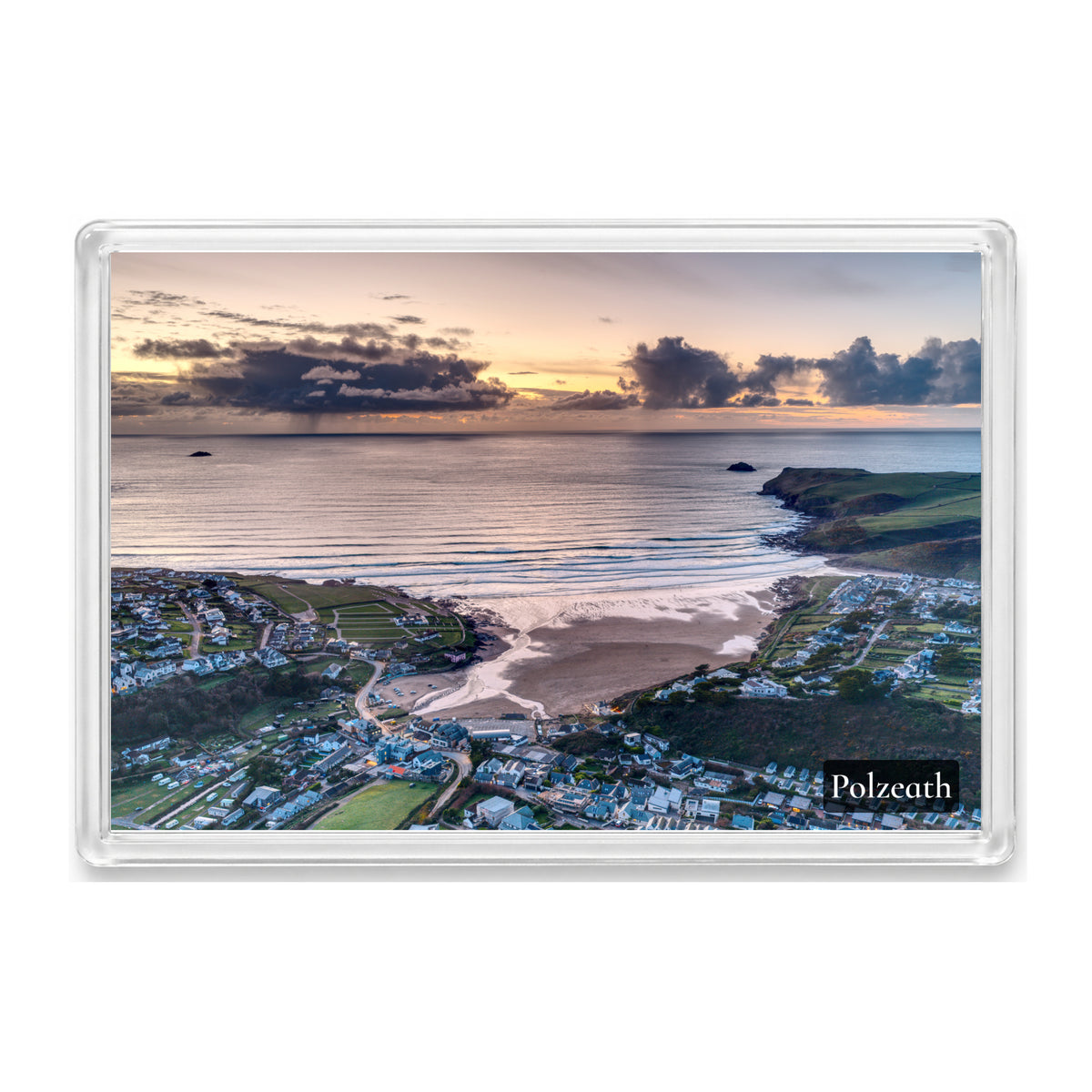 Polzeath fridge magnet showing a moody Atlantic sunset with orange light breaking through rain clouds and curtains of rain offshore