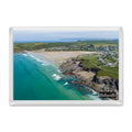 Polzeath fridge magnet showing exposed low-tide rocks and reef surrounded by clear turquoise water and pale sand